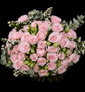 Bouquet of baby pink roses, white statice, white alstromeria and grey pennygum on a black background