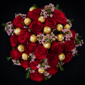 Romance & Rocher Bouquet featuring premium red roses, Ferrero Rocher chocolates and delicate pink waxflower by Blooms & Gifts Etcetera.