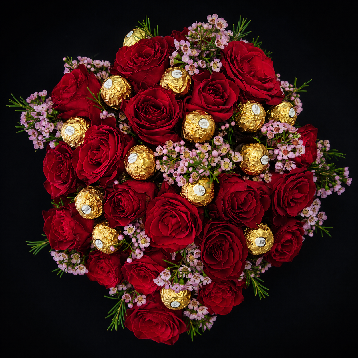 Romance & Rocher Bouquet featuring premium red roses, Ferrero Rocher chocolates and delicate pink waxflower by Blooms & Gifts Etcetera.