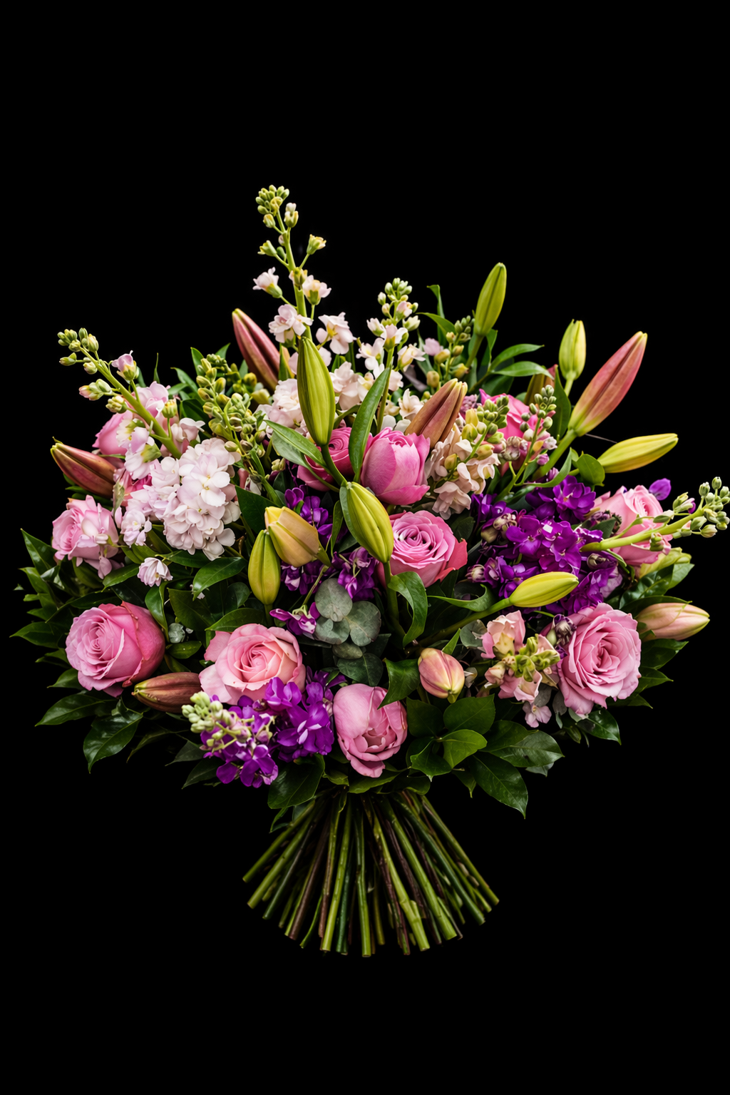 Mixed pink, pastel and mauve bouquet with pink lilies, pink stocks, mauve stocks, pink snapdragons, dusty pink roses, green ruscus and grey pennygum